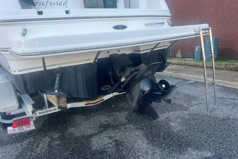 Slide: The Image of Rear view of a 2001 Chaparral Signature 260 boat on a trailer, showing propeller and ladder. - 5