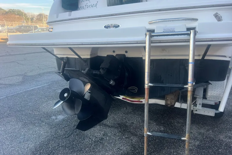 Slide: The Image of Rear view of a 2001 Chaparral Signature 260 boat with propeller and ladder. - 6