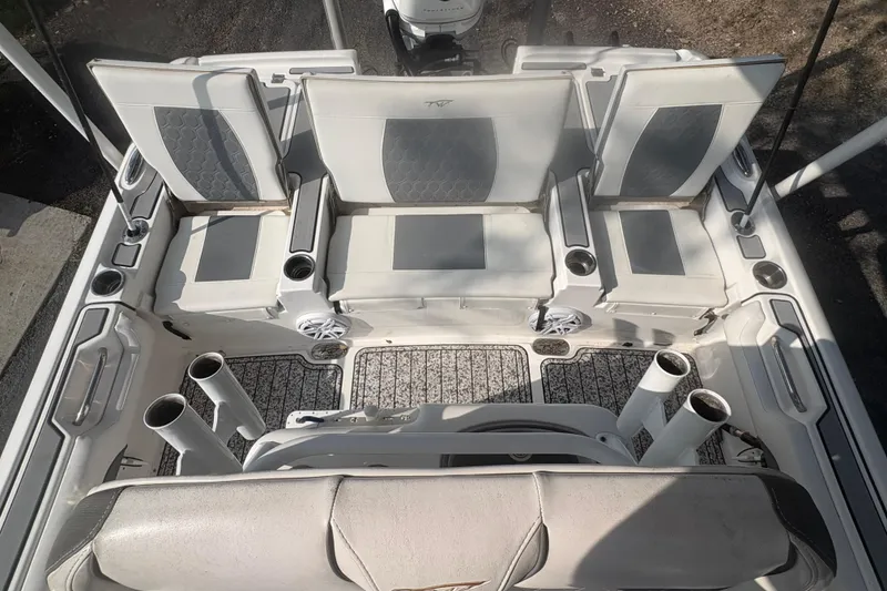 Slide: The Image of 2018 Tidewater 2500 Carolina Bay boat interior with seating and rod holders. - 13