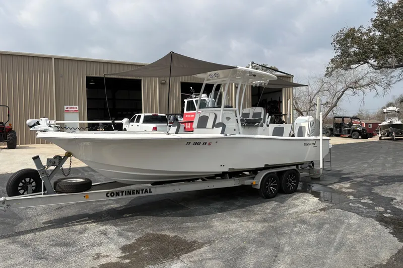 Slide: The Image of 2018 Tidewater 2500 Carolina Bay boat on trailer outside a warehouse. - 15