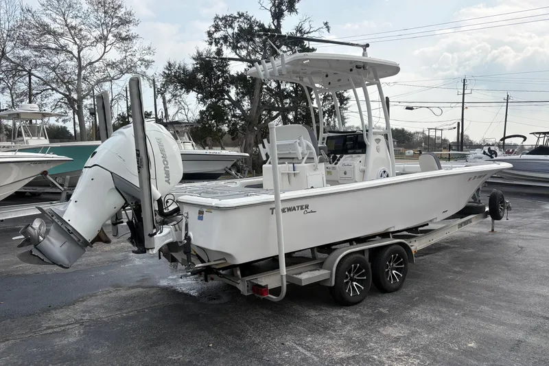 Slide: The Image of 2018 Tidewater 2500 Carolina Bay boat on trailer with Mercury outboard motor. - 3