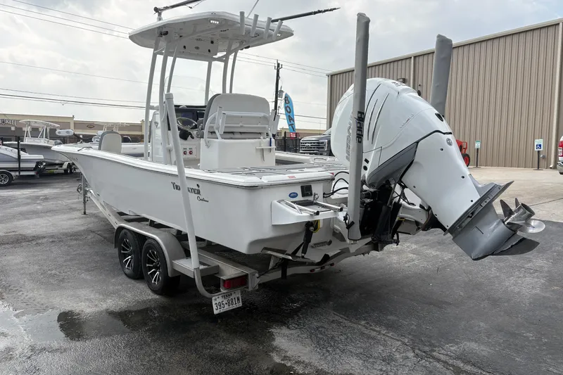 Slide: The Image of 2018 Tidewater 2500 Carolina Bay boat on trailer, featuring powerful outboard motor. - 5