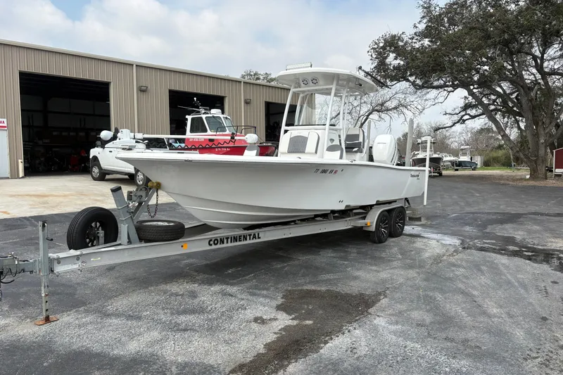 Slide: The Image of 2018 Tidewater 2500 Carolina Bay boat on trailer outside storage facility. - 7