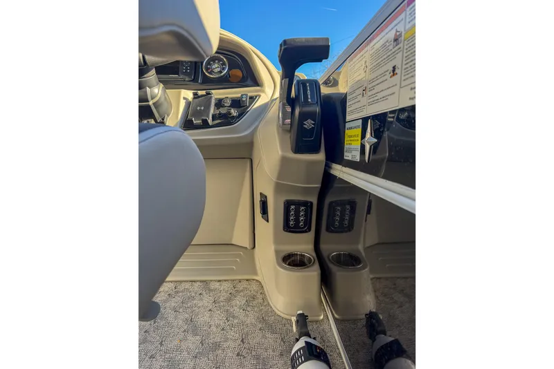 Slide: The Image of 2025 Berkshire 22CL LE boat cockpit with controls and cup holders. - 10