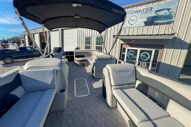 Slide: The Image of 2025 Berkshire 22CL LE pontoon boat interior at Big Water Marine dealership. - 2