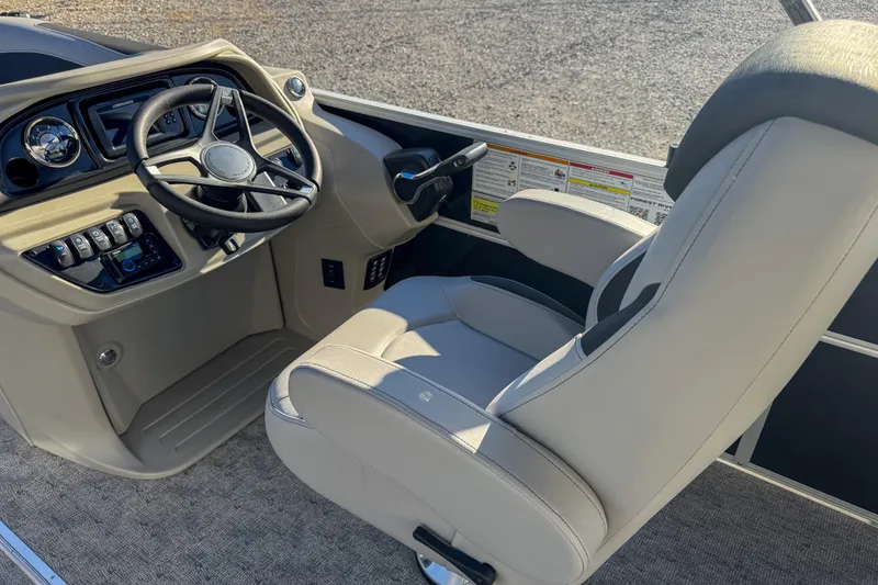 Slide: The Image of 2025 Berkshire 22CL LE boat interior with steering wheel and captain's chair. - 8