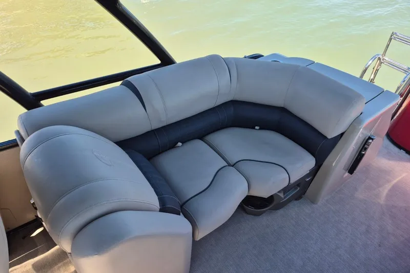 Slide: The Image of Luxurious seating on a 2017 Avalon 2785 boat, featuring plush gray upholstery. - 10