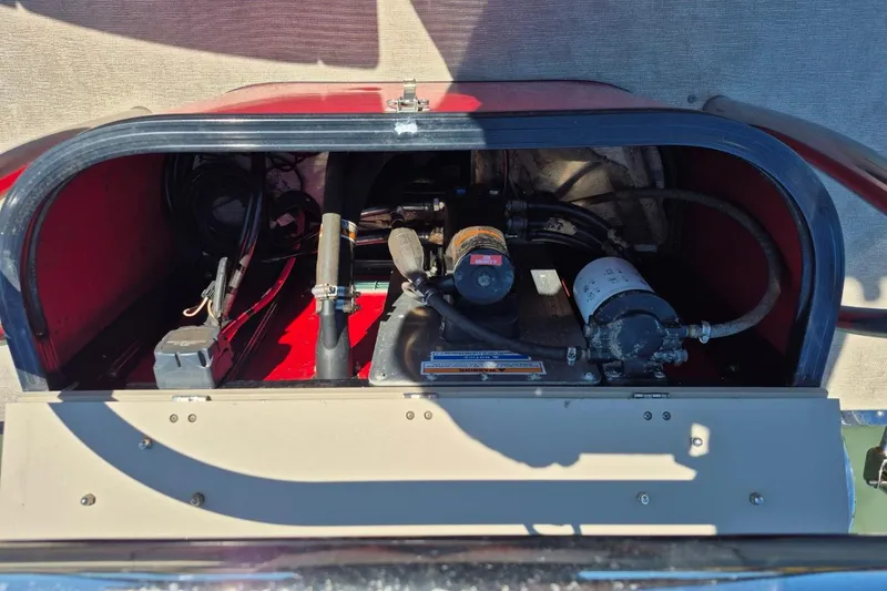 Slide: The Image of Engine compartment of a 2017 Avalon 2785, showcasing mechanical components and wiring. - 13