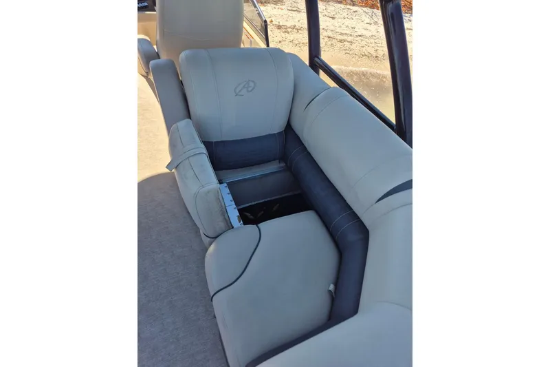 Slide: The Image of 2017 Avalon 2785 boat interior with beige and gray seating. - 16