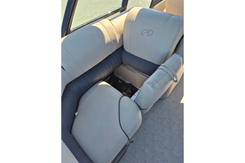 Slide: The Image of 2017 Avalon 2785 boat interior with gray and blue seating. - 17