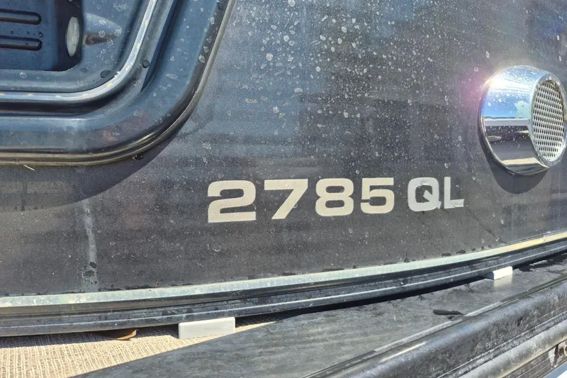 Slide: The Image of Close-up of 2017 Avalon 2785 QL boat model name on hull. - 26