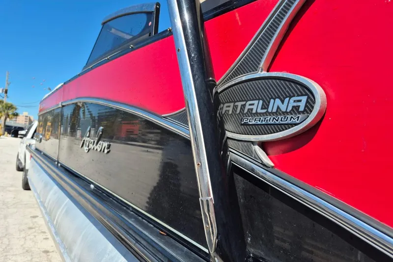 Slide: The Image of 2017 Avalon 2785 Catalina Platinum boat with red and black exterior detailing. - 27