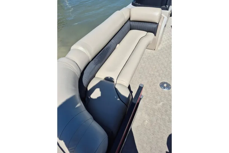 Slide: The Image of 2017 Avalon 2785 boat interior with beige seating and water view. - 6