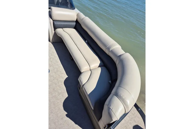 Slide: The Image of Luxurious seating on a 2017 Avalon 2785 boat, overlooking calm waters. - 7