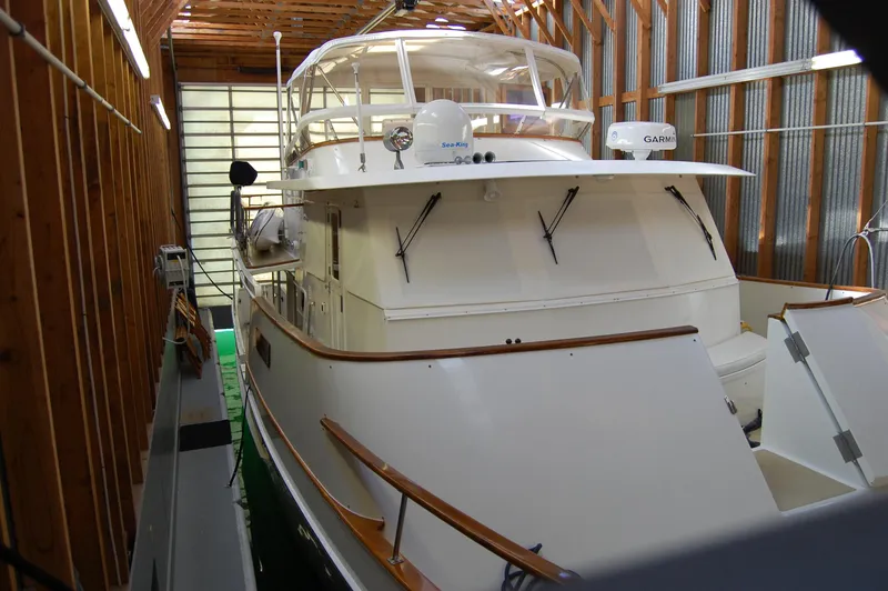 Slide: The Image of 1981 Ocean Alexander 50 Pilothouse in a boathouse. - 22