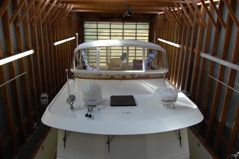 Slide: The Image of 1981 Ocean Alexander 50 Pilothouse in a boathouse. - 26