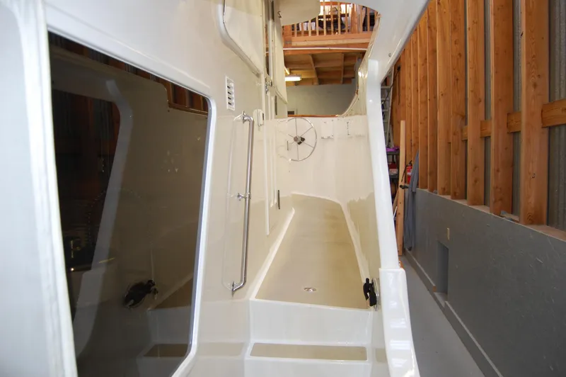 Slide: The Image of Side deck of 1981 Ocean Alexander 50 Pilothouse in a boatyard. - 30