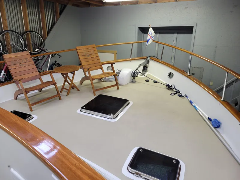 Slide: The Image of 1981 Ocean Alexander 50 Pilothouse yacht deck with chairs and table. - 32