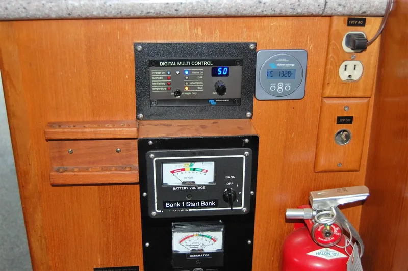 Slide: The Image of 1981 Ocean Alexander 50 Pilothouse control panel with fire extinguisher. - 35