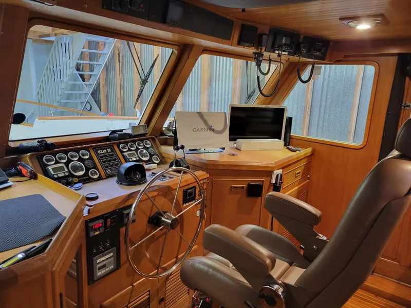 Slide: The Image of 1981 Ocean Alexander 50 Pilothouse interior with navigation equipment. - 37
