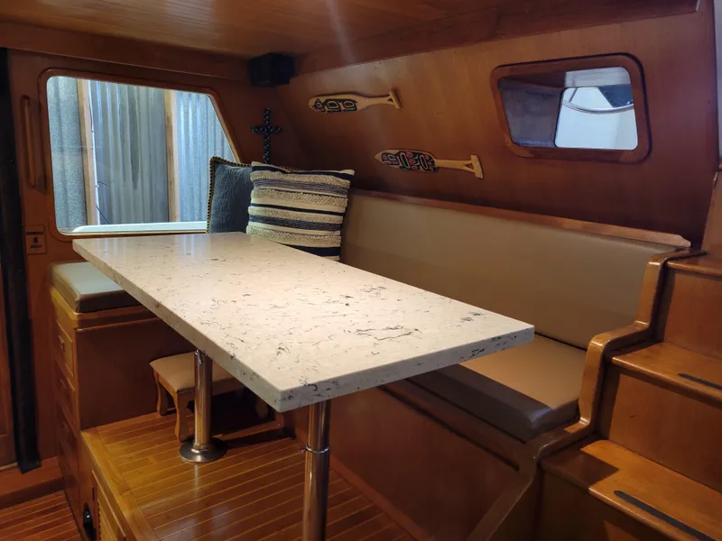 Slide: The Image of Interior of 1981 Ocean Alexander 50 Pilothouse yacht with dining table. - 38