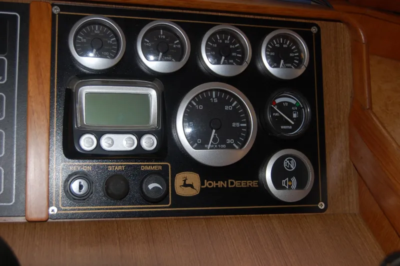 Slide: The Image of Dashboard of a 1981 Ocean Alexander 50 Pilothouse with John Deere instruments. - 40