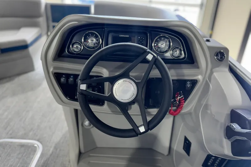 Slide: The Image of Steering console of 2025 Berkshire 22RFC LE boat with gauges and controls. - 16