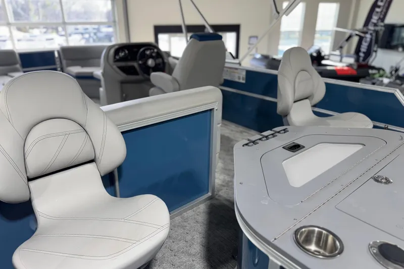 Slide: The Image of Interior of 2025 Berkshire 22RFC LE pontoon boat with modern seating and control panel. - 19