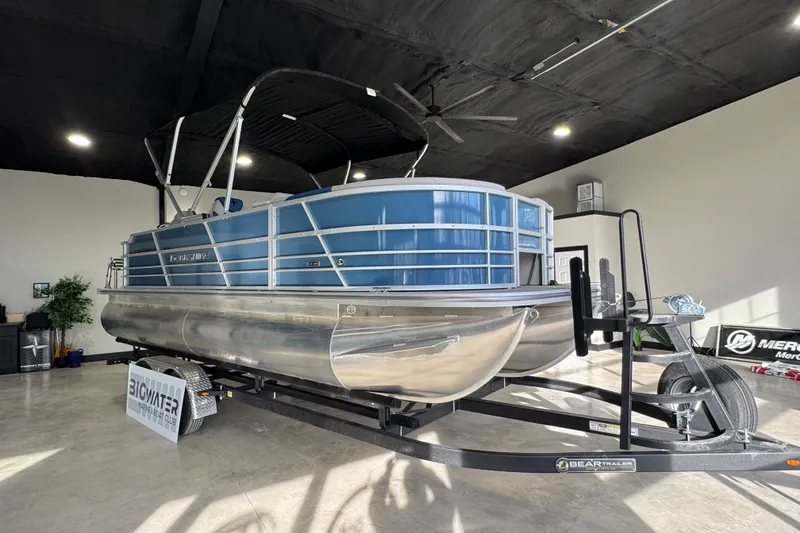 Slide: The Image of 2025 Berkshire 22RFC LE pontoon boat on trailer in showroom. - 5