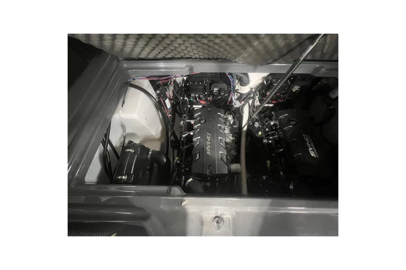 Slide: The Image of Engine compartment of 2021 Yamaha Boats 255XD, showcasing dual engines and wiring. - 12