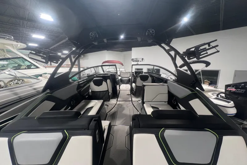 Slide: The Image of Interior view of 2021 Yamaha Boats 255XD, showcasing sleek seating and modern design. - 16