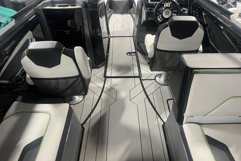 Slide: The Image of Interior of a 2021 Yamaha Boats 255XD, featuring sleek seating and modern design. - 17