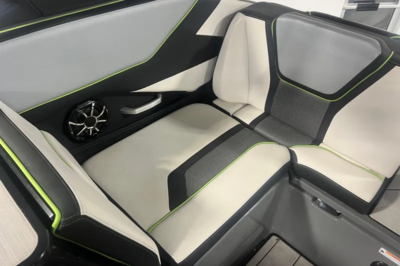 Slide: The Image of 2021 Yamaha Boats 255XD interior seating with stylish upholstery and integrated speaker. - 18