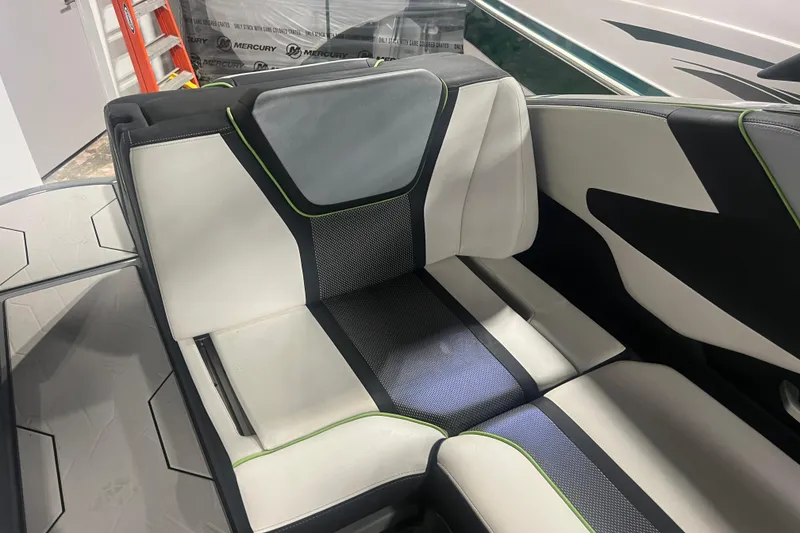 Slide: The Image of 2021 Yamaha Boats 255XD interior seating with modern design and contrasting colors. - 20