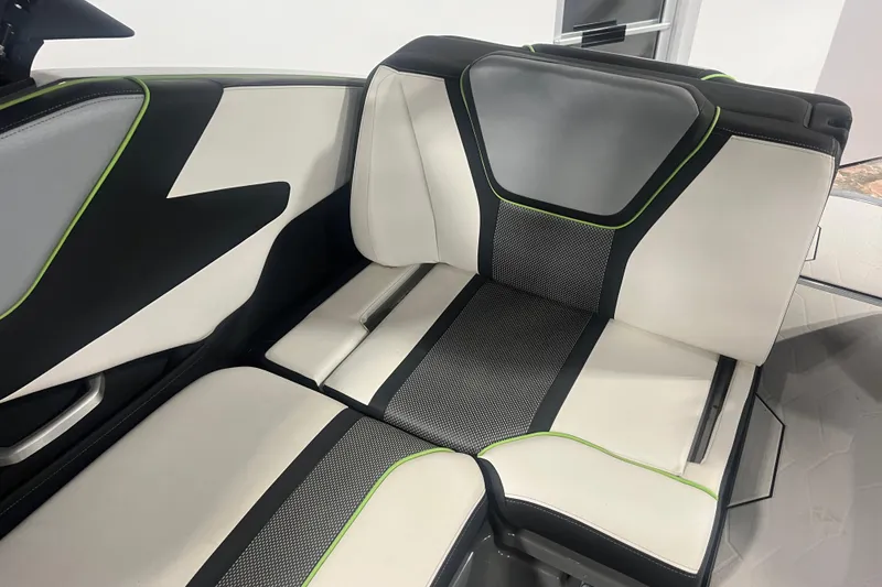 Slide: The Image of 2021 Yamaha Boats 255XD interior seating with modern black, white, and green design. - 21