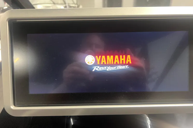Slide: The Image of Display screen showing Yamaha logo and slogan on a 2021 Yamaha Boats 255XD. - 23