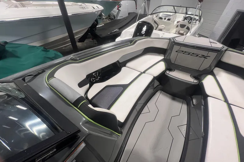 Slide: The Image of Interior view of a 2021 Yamaha Boats 255XD, showcasing sleek seating and modern design. - 28