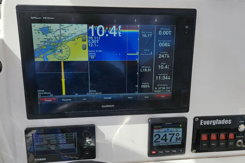 Slide: The Image of Garmin GPS display on 2015 Everglades 255 Center Console boat dashboard. - 13