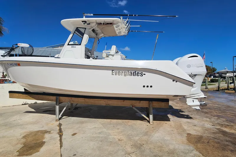 Slide: The Image of 2015 Everglades 255 Center Console boat on display, featuring dual Yamaha engines. - 2
