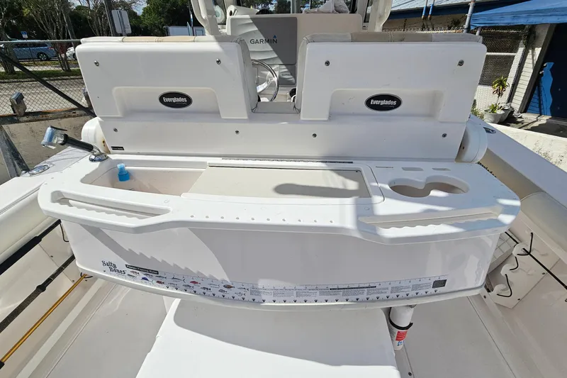 Slide: The Image of 2015 Everglades 255 Center Console boat with fishing station and storage compartments. - 21
