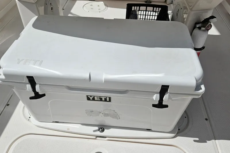 Slide: The Image of White YETI cooler on 2015 Everglades 255 Center Console boat deck. - 22