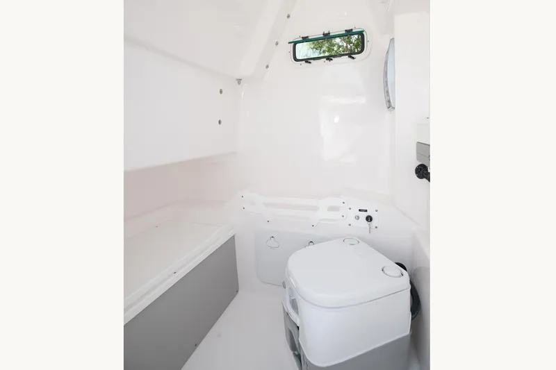 Slide: The Image of Manufacturer Provided Image: Interior of 2015 Everglades 255 Center Console boat with compact toilet. - 31