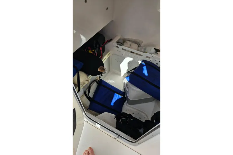 Slide: The Image of Interior storage of 2015 Everglades 255 Center Console boat with equipment and supplies. - 36