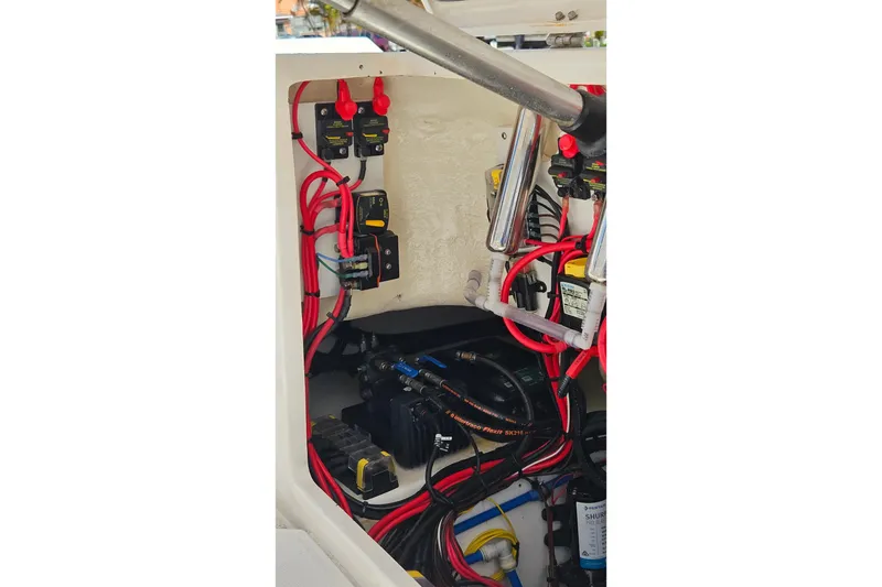 Slide: The Image of Electrical wiring and components inside a 2015 Everglades 255 Center Console boat. - 42