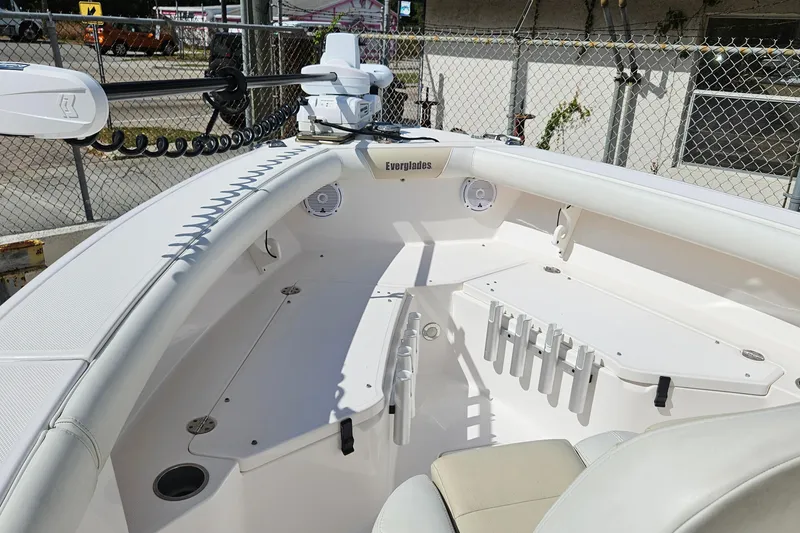 Slide: The Image of 2015 Everglades 255 Center Console boat interior with rod holders and seating. - 6
