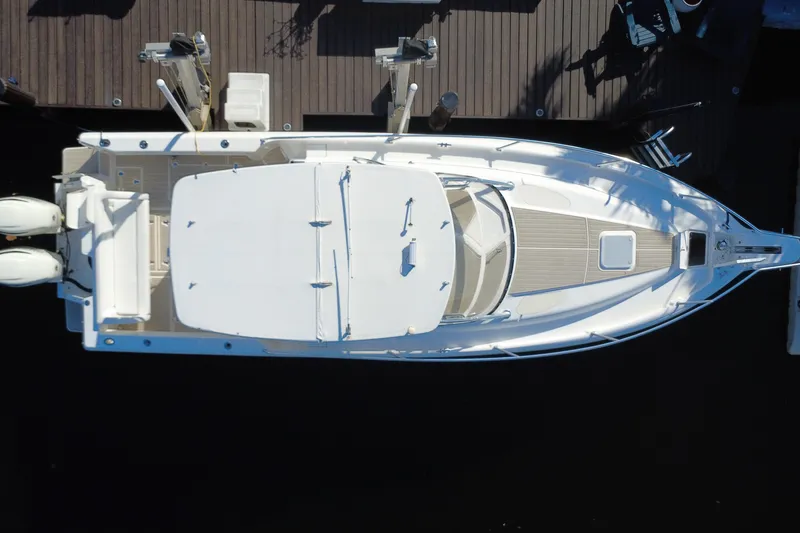 Slide: The Image of Aerial view of 2005 Intrepid 348 Walkaround boat docked at a marina. - 14
