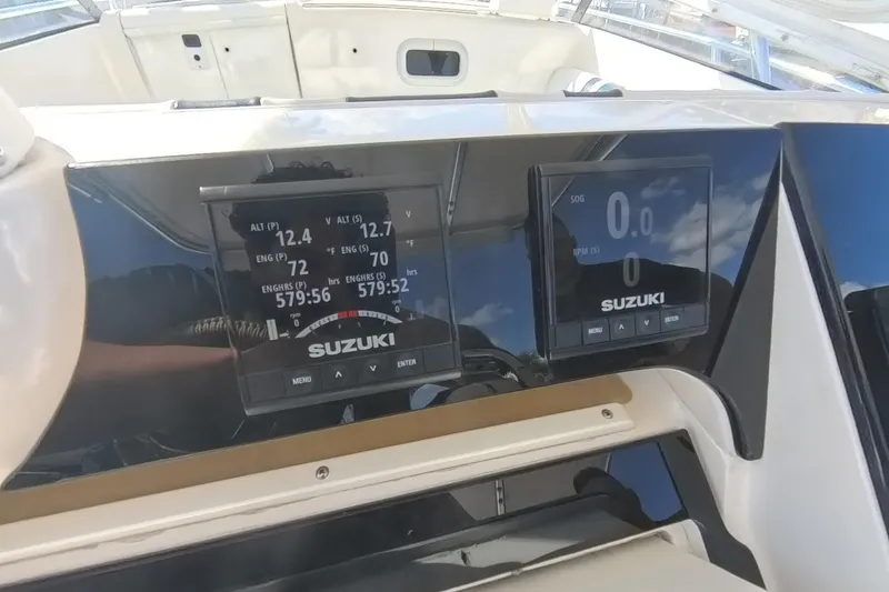 Slide: The Image of Dashboard of a 2005 Intrepid 348 Walkaround boat with Suzuki engine displays. - 38