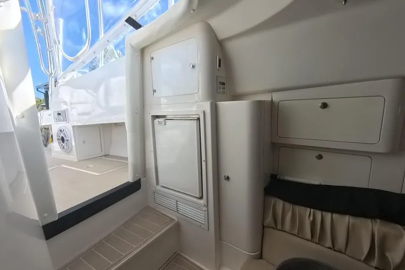 Slide: The Image of 2005 Intrepid 348 Walkaround interior with storage compartments and seating area. - 48