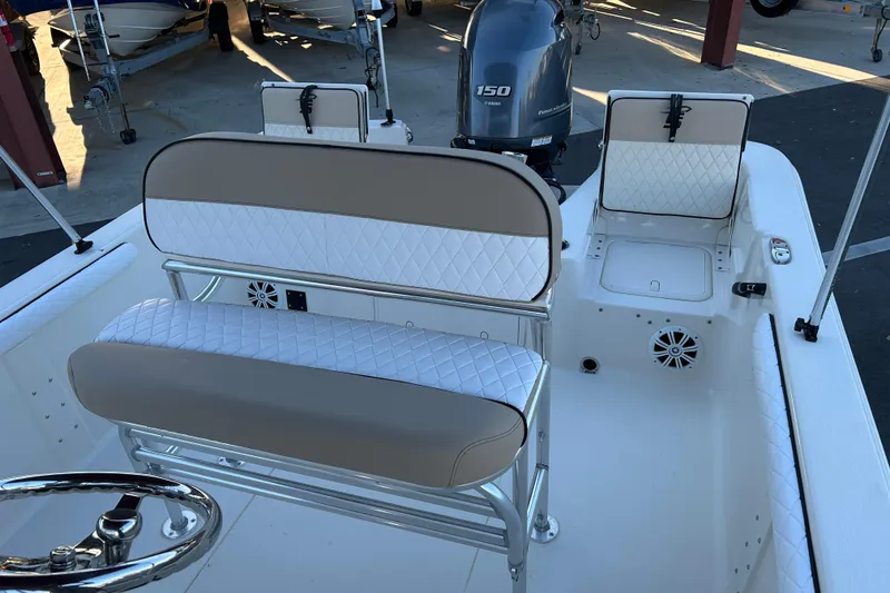 Slide: The Image of 2020 Carolina Skiff 21 LS boat interior with seating and Yamaha 150 engine. - 12