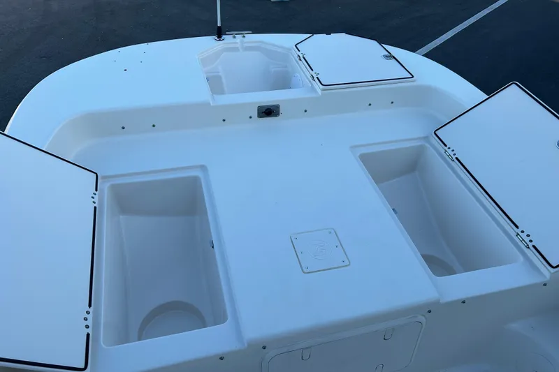 Slide: The Image of 2020 Carolina Skiff 21 LS boat deck with open storage compartments. - 14